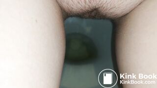 Showing hairy pussy while shitting