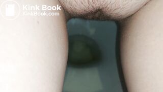 Showing hairy pussy while shitting