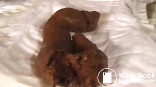 Sweet asian takes a shit on a diaper