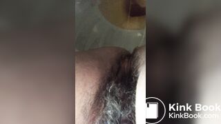 Hairy milf unloads logs between her legs into the bowl
