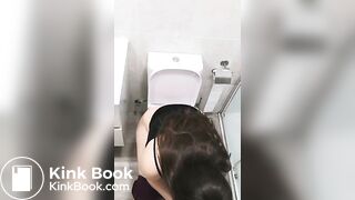 Cute chubby girl pooping on toilet