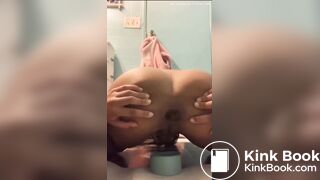 Cute ebony teen tries to poop in cup