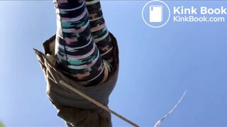 Young woman pooping outdoors