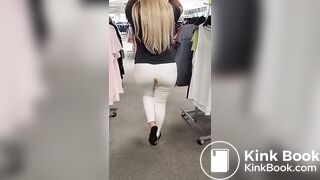 Blonde girl shits in white jeans