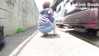 Asian girl pooping in public parking lot