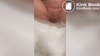 Pissing into a running bath before digging out shit