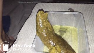 Girl shitting big turd into a plastic container