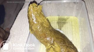 Girl shitting big turd into a plastic container