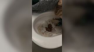 Licking a shit filled toilet