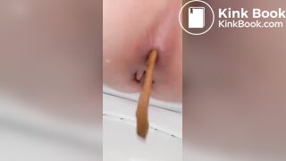 Girl emptying on the toilet