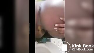Queen pooping on toilet.