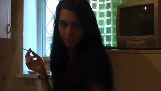 Cute girl is smearing shit on her body