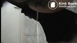 Woman in a coat spied taking an explosive shit