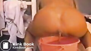 Girl shitting in bucket