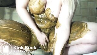 Busty blonde slut smears her body with shit