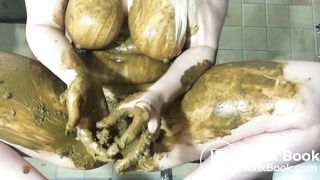 Busty blonde slut smears her body with shit