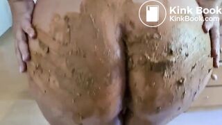 a woman spreads shit on her big tits