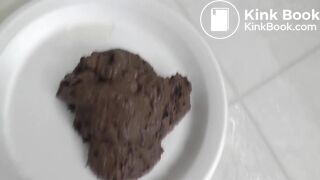 Beautiful brunette shitting on a plate