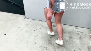 in the parking lot, the guy helped his girlfriend wash