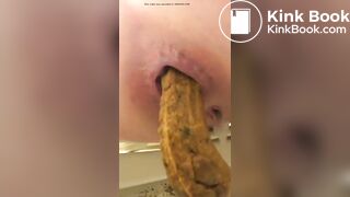 Chick Grunting Out Big Log in Toilet