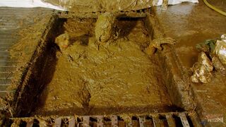 Betty submerges in cowshit during her workout