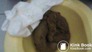 Shit into a plastic potty