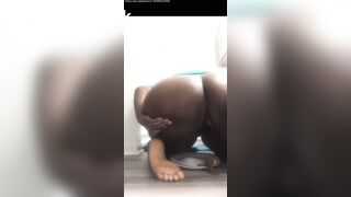 Ebony shitting on plate
