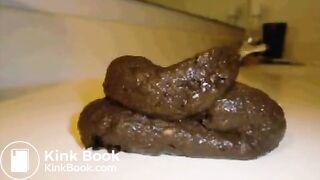 On her side shitting on a countertop