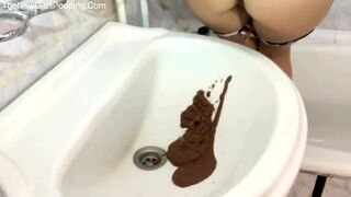 Girl shitting diarrhea into a basin