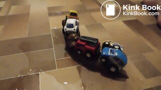 she fastened toy cars with her shit in the train