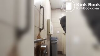 Woman has diarrhea on bathroom wall