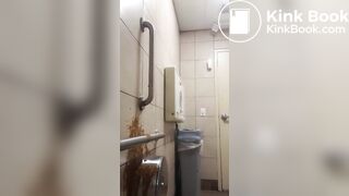 Woman has diarrhea on bathroom wall