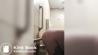 Woman has diarrhea on bathroom wall