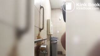 Woman has diarrhea on bathroom wall