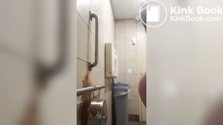 Woman has diarrhea on bathroom wall