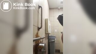 Woman has diarrhea on bathroom wall