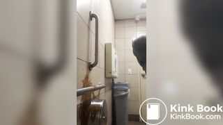 Woman has diarrhea on bathroom wall
