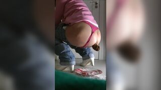 Girl in pink thong shits