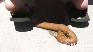 Outdoor Girl pooping hard turd