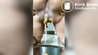 Thick ebony squeezing a creamy poop out