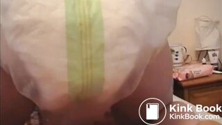 Girl poops diaper and plastic pants 1