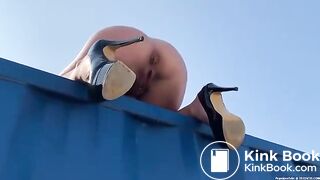 Blond Woman Shits Off A Storage Container