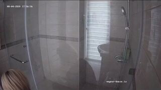 A blonde chick takes a shit in bathroom (mirror)