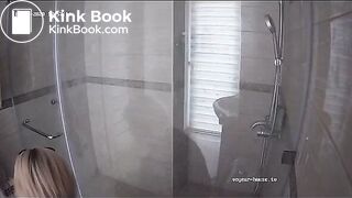 A blonde chick takes a shit in bathroom (mirror)