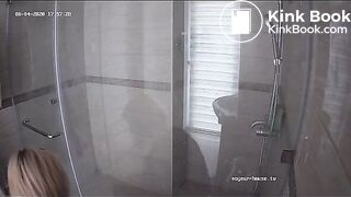 A blonde chick takes a shit in bathroom (mirror)