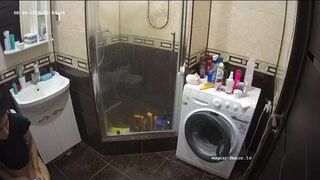 A young chick pooping in bathroom while using phone