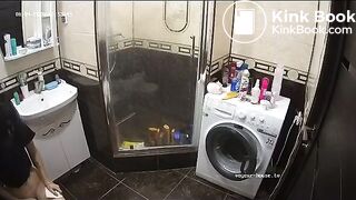 A young chick pooping in bathroom while using phone