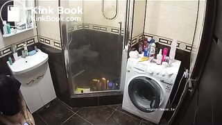 A young chick pooping in bathroom while using phone