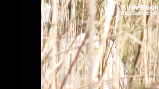 Voyeur spies on girll shitting in tall grass