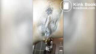 Ebony shitting and pissing over toilet